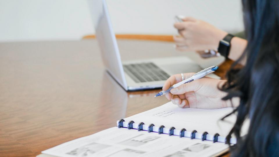 Two people working at a table