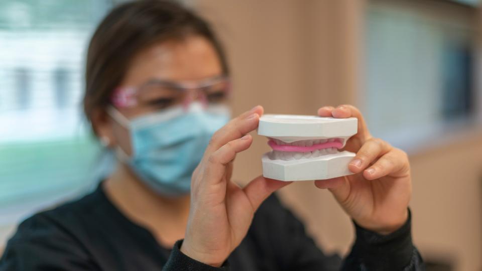 Dental Hygiene student examining mold