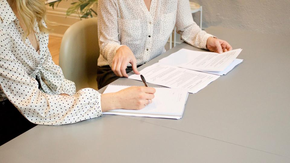 women looking over paperwork