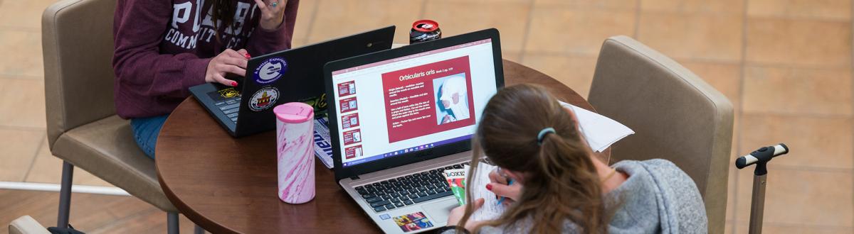 students in AB Commons using laptops