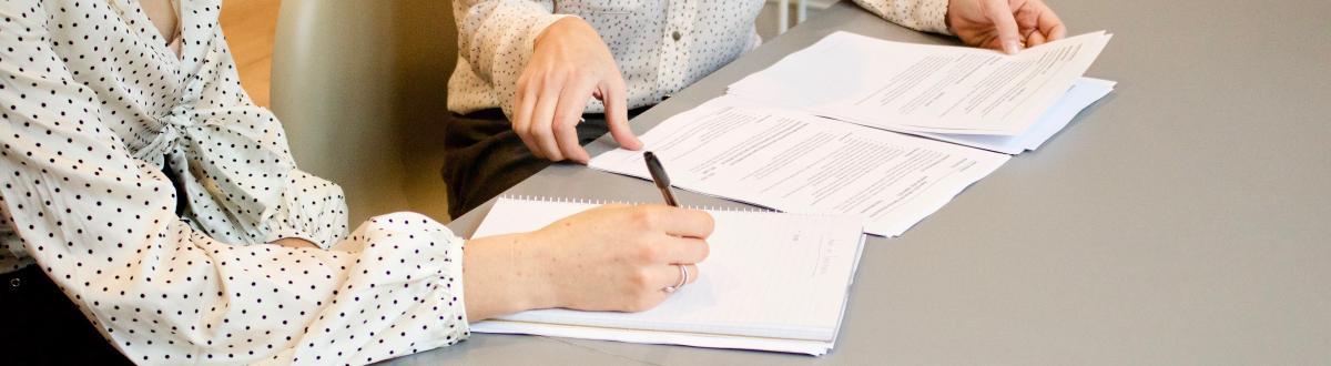 women looking over paperwork