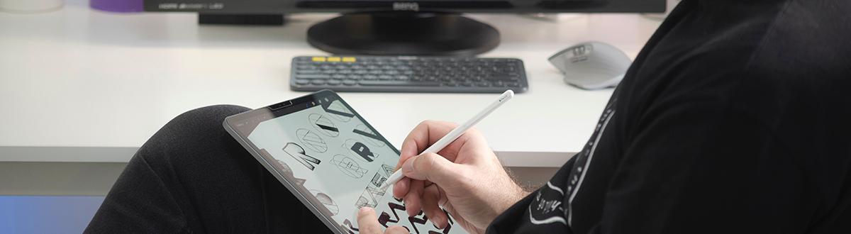 graphic designer using tablet and stylus