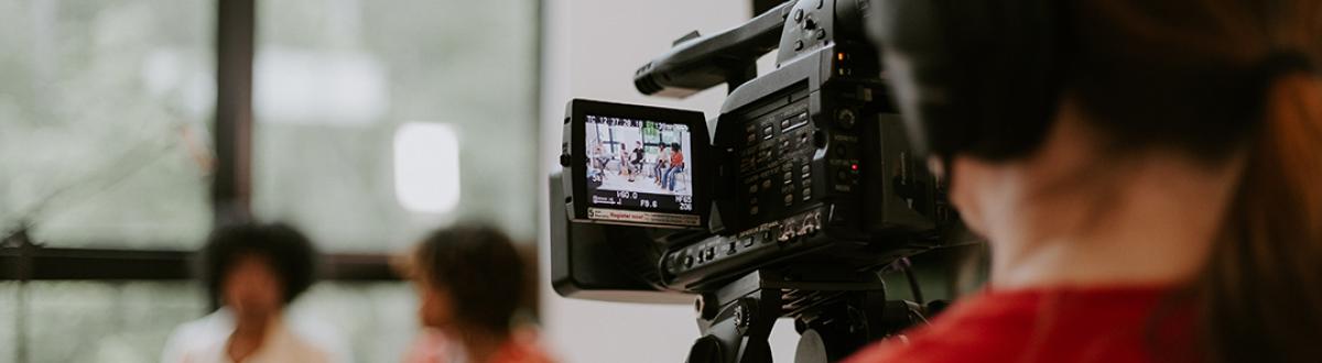 an interview being viewed from behind a video camera