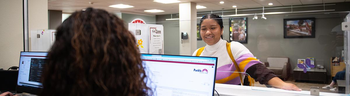 Student at Welcome Center desk